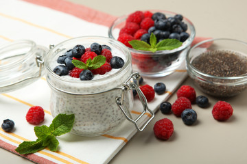 chia pudding with natural yogurt and fresh berries close-up on the table.
