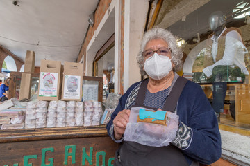 portrait of woman selling traditional mexican sweets