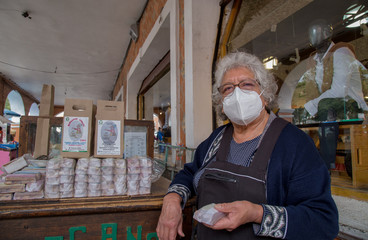 portrait of woman selling traditional mexican sweets