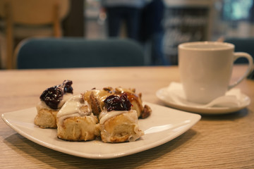 assorted cakes with cream in a cafe close-up