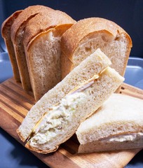 loaf of bread, ham cheese sandwiches 