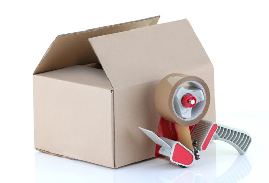 Cardboard Box And Packing Tape Gun On White