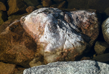 Big cracked stones and granite rocks debris.