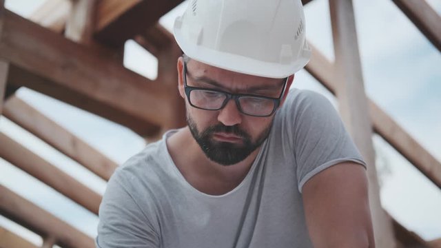 Male architect, designer working on building a house