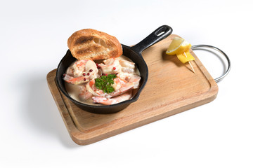 shrimp in a creamy sauce in a pan