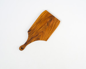 wooden chopping board used for cutting. This cutting board is also used for cutting meat and bones. Wooden cutting board that has a different and unique texture, made from recycled wood scraps.