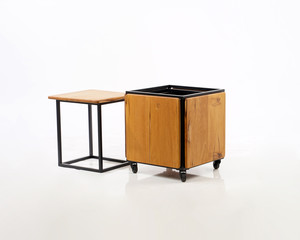 a box concept, a combination of wood and iron, so that it becomes a table and chair that is very compact and doesn't take up space.