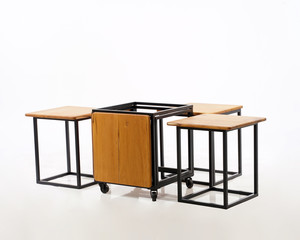 a box concept, a combination of wood and iron, so that it becomes a table and chair that is very compact and doesn't take up space.