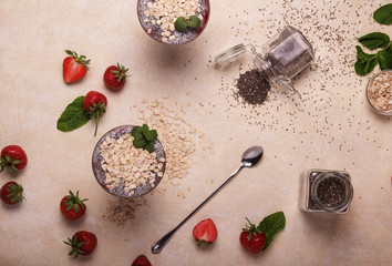 Healthy eating. Desserts with strawberries, chia seeds and oatmeal. Top view