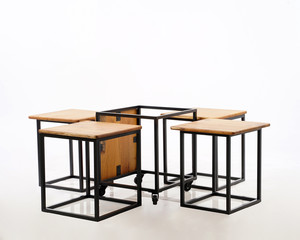 a box concept, a combination of wood and iron, so that it becomes a table and chair that is very compact and doesn't take up space.