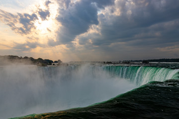 Niagara Falls Horseshoe Falls on a summer day with mist clouds