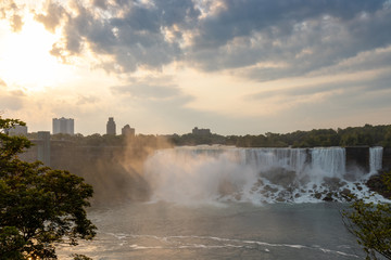 Niagara Falls American Falls with early morning sunrise and overcast sky