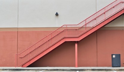 Generic architecture of stairs on a wall. Minimalism image with pink and white wall background and copy space.