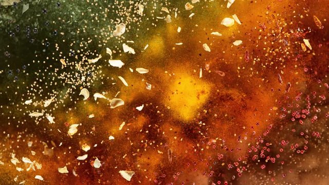 Super Slow Motion Shot of Colorful Seasoning Explosion on Black Background at 1000fps.