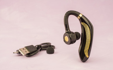 Close-up of mobile handsfree bluetooth device.