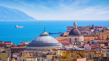 Dome of San Francesco di Paola church towering over roofs of neighboring houses in Naples, Italy. - obrazy, fototapety, plakaty