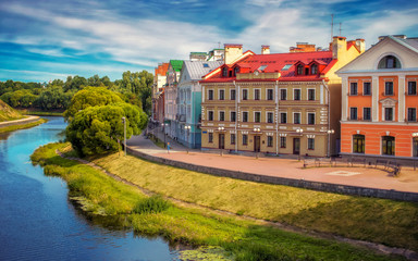 Urban architecture, beautiful houses by the river. Golden Embankment, Pskov, Russia. - obrazy, fototapety, plakaty