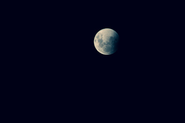 Naklejka premium Very detailed moon in the sky on black background