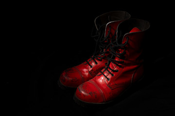 Red punk boots with black background