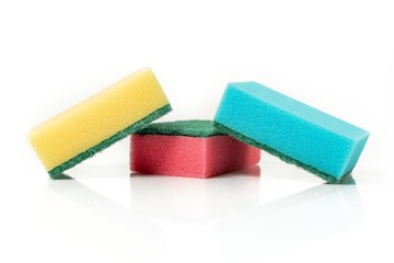 Multicolored sponges for cleaning, isolated on white background. Sponges for dishwashing.
