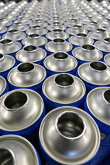 Empty steel aerosol cans in factory