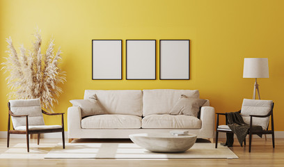 Blank three poster frames mock up in yellow room interior , 3d rendering