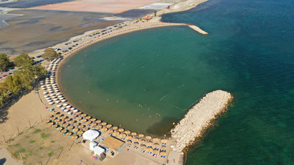 Aerial drone photo of organised sandy beach in area Tourlida of Kleisova lagoon featuring seaside traditional settlement, Mesolongi, Aitoloakarnania, Greece