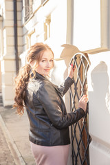 Fototapeta premium Travel through the cities of Europe. Attractive girl, woman at the