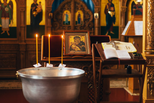 small room with baptismal font in the crypt