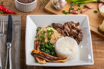 Minced beef tenderloin. Traditional Brazilian food (Picadinho). Selective focus