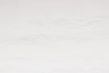 Rock plastered stucco wall. A part of a white wall. Stucco wall, white texture, white background, wall background. Blank concrete wall white color.