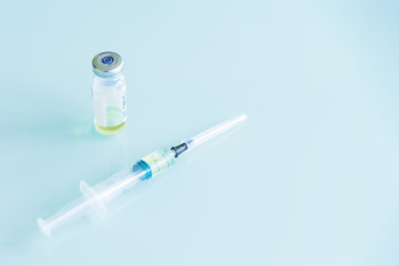 medical syringe and vials with vaccine, medicine