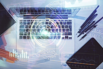 Multi exposure of data drawing hologram over topview of study desk background with computer. Concept of technology.
