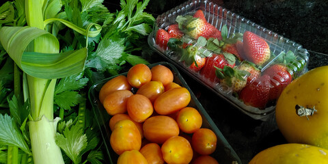 A small variety of fruits and vegetables that have just arrived from the organic fair.