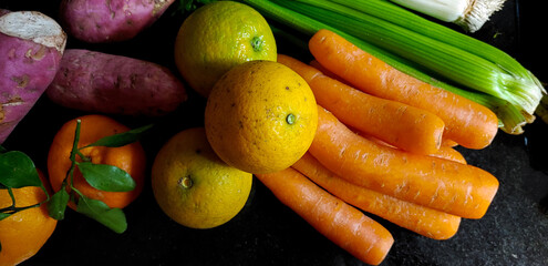 A small variety of fruits and vegetables that have just arrived from the organic fair.