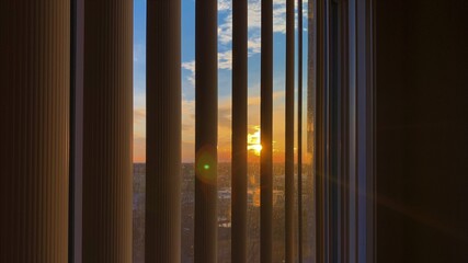 sunset through window blinds
