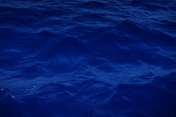 Fototapeta na wymiar Blue water surface with ripples