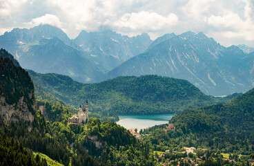 The Neuschwanstein Castle with the Bavarian Alps in the background