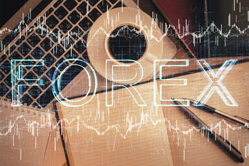 Stock market chart and top view computer on the table background. Double exposure. Concept of financial analysis.