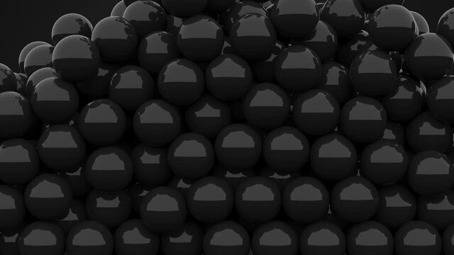 3D black plastic balls pouring a pool / screen on a black background with alpha matte. Candy / dragee / caviar filling a screen. Falling pills.