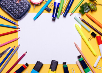 Mockup of Empty paper, pencils, cloak, calculator, highlighters on yellow background