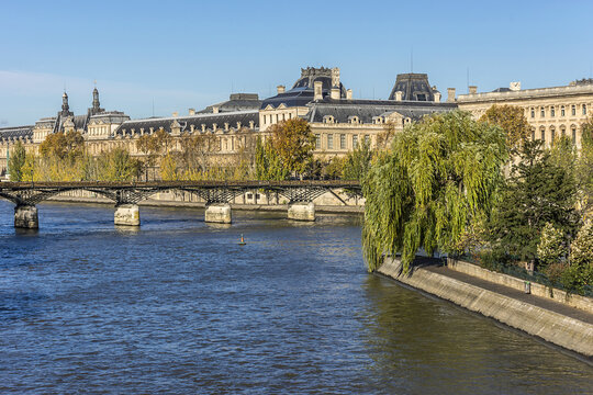 View of famous Louvre Museum from the Seine river. Louvre Museum is one of the largest and most visited museums worldwide. PARIS, FRANCE. November 12, 2014.