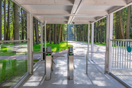 Steel automatic turnstile with arrows for access to the public park