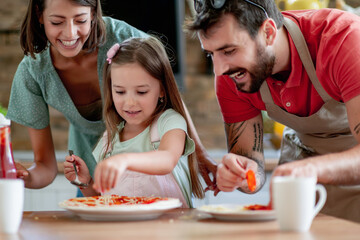 Family enjoying in their kitchen