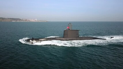 Aerial Close up of a submarine underway on open sea surface. Navy organised Naval Parade in Bosphorus Sea, Strait of Istanbul. Tracking shot
- Powered by Adobe