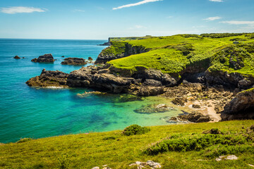 Turquoise sea at a secluded cove near Broad Haven on the Pembrokeshire coast in early summer