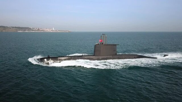 Aerial Close up of a submarine underway on open sea surface. Navy organised Naval Parade in Bosphorus Sea, Strait of Istanbul. Tracking shot
