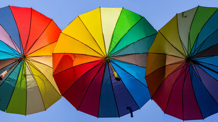 Colorful umbrellas hanging on the street