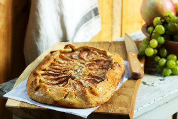 Homemade apple pie with streusel and fresh fruit. Rustic style.