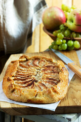 Homemade apple pie with streusel and fresh fruit. Rustic style.